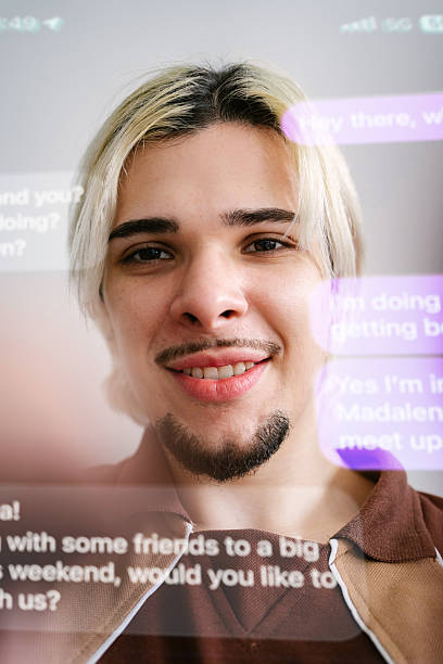 istock Young man in personal perspective text messaging in English 2219868822