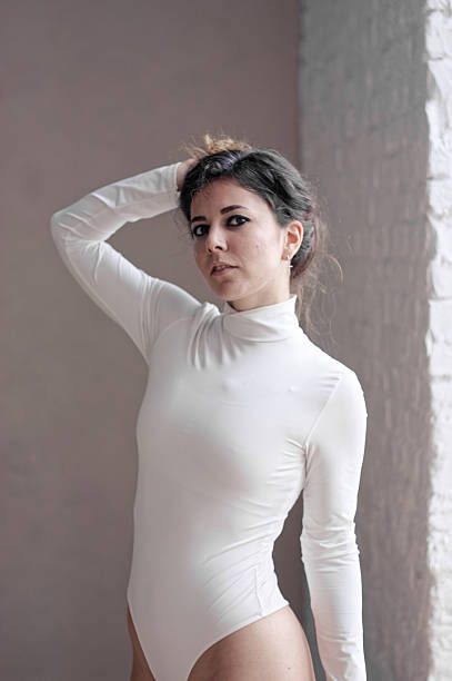 istock A young woman in white bodysuit in studio 2219873244
