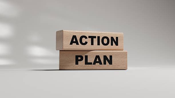 istock Action plan. wooden blocks spelling.Flat lay view from above on white background with wooden blocks buttons.IT technology concept.3D rendering on white background. 2219875004