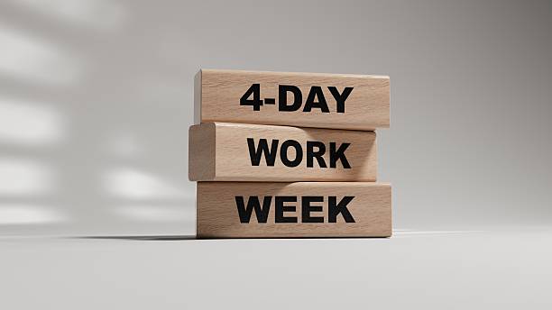 istock 4-day work week symbol. Concept words 4-day work week on wooden blocks.Business and 4-day work week concept. Copy space.3D rendering on white background. 2219875063