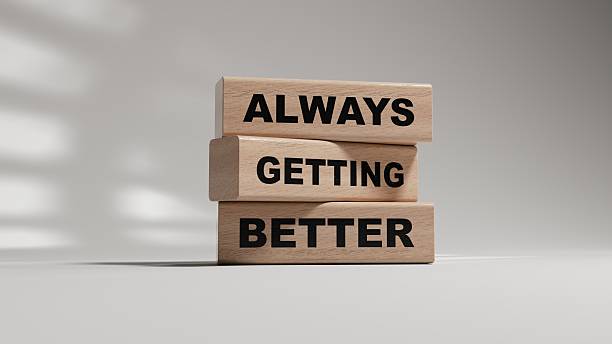 istock Always getting better symbol. wooden blocks with words Always getting better.Business and Always getting better concept.Copy space.3D rendering on white background. 2219875071