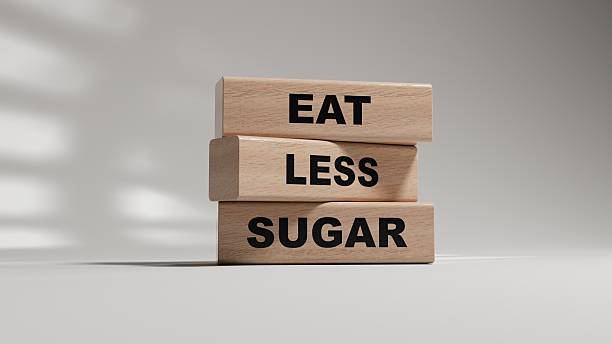 istock eat less sugar words on notebook and stethoscope on wooden blocks. wooden blocks. Copy space.3D rendering on white background. 2219875087