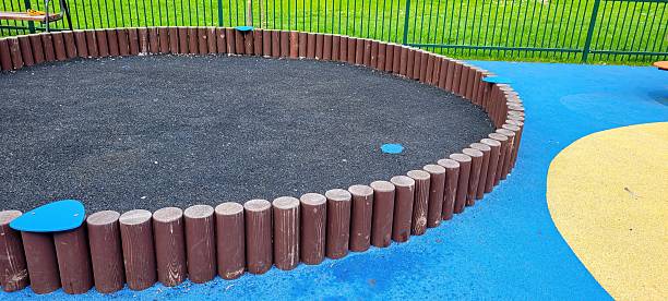 istock A vibrant and colorful playground featuring a spacious sandpit along with durable rubber flooring 2219878106