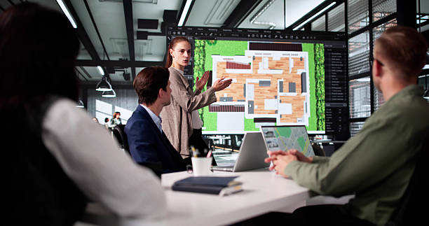 istock Young Designer Presenting 3D House Floor Plan 2219887847