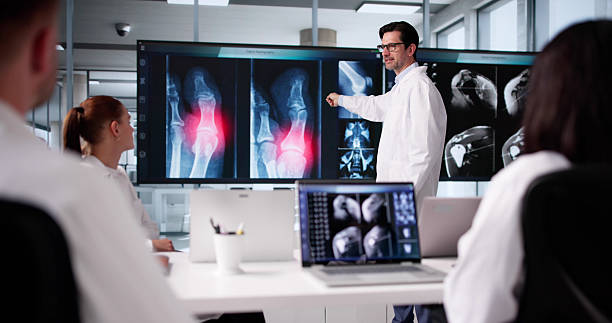 istock Radiologist And Professor Team Up For Group Conference 2219888449