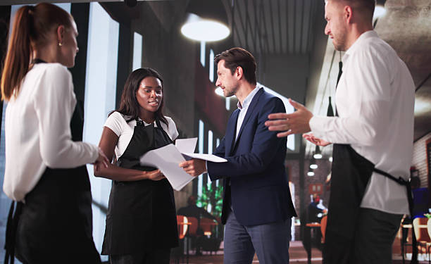 istock Frustrated Restaurant Boss Arguing With Diverse Team 2219888517