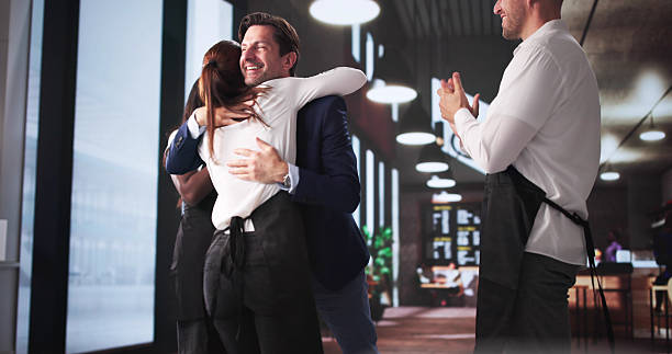istock Celebrating Success: Cafe Manager Shares Good News 2219888522