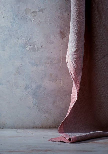 istock Textured Pink Linen Draped Against Plaster Wall 2219888618