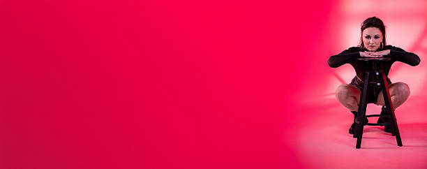 istock Dynamic and EyeCatching Portrait of a Model Set Against a Vibrant Pink Background 2219889885