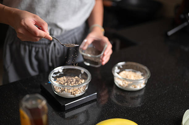 Woman Adding Chia Seeds to Overnight Oats