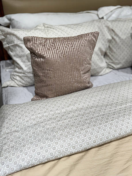 istock Image of interior design bedroom with brown and beige colour-coordinated liners, pillows, cushions, bed sheets, duvet cover 2219892619