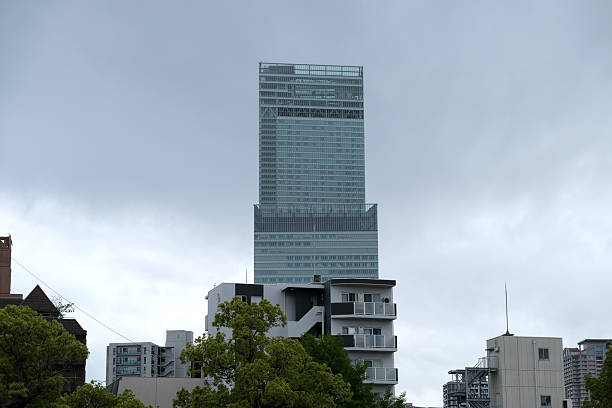 View of Abeno Harukas under overcast sky, a supertall skyscraper, 300 m tall, the tallest in Osaka, Japan.