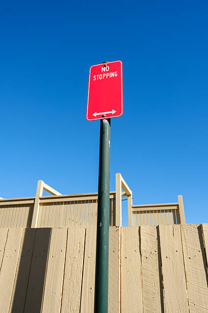 istock Red No stopping sign on a metal pole 2219904743