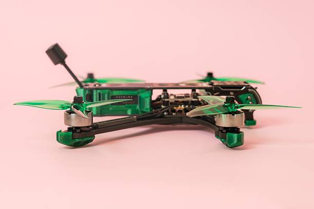 istock Close up view on modern drone with camera isolated on pink background 2219911235