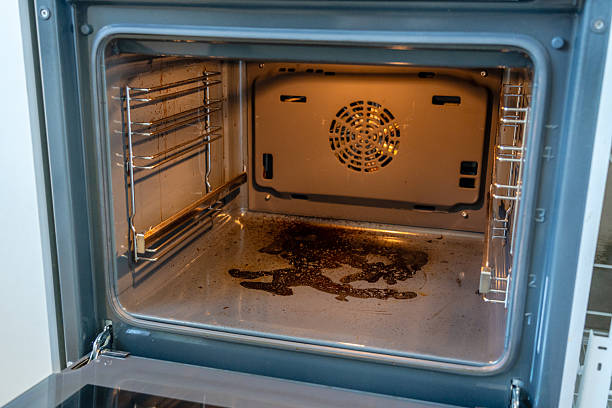 istock Close up inside view of dirty oven with deposits on bottom 2219911239