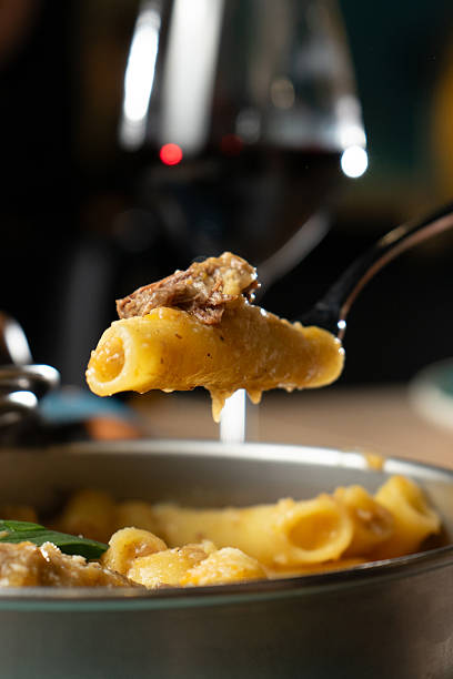 istock Pasta ziti alla genovese at a restaurant table 2219915122