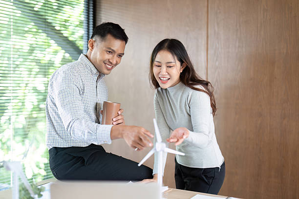 istock Sustainable Solutions. Team brainstorming renewable energy projects in a collaborative workspace. 2219915627