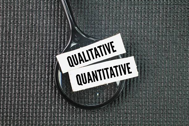 istock magnifying glass and paper with the words quantitative and qualitative 2219915937