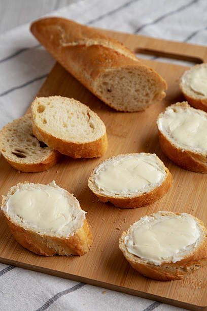 istock Homemade Bread and Butter on a bamboo board, side view. 2219916203