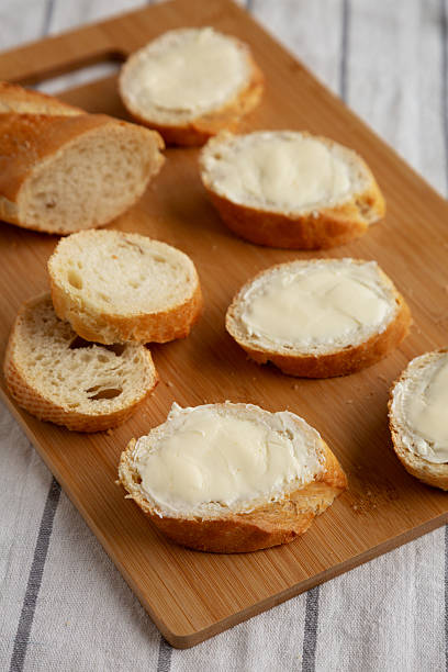 istock Homemade Bread and Butter on a bamboo board, side view. 2219916264