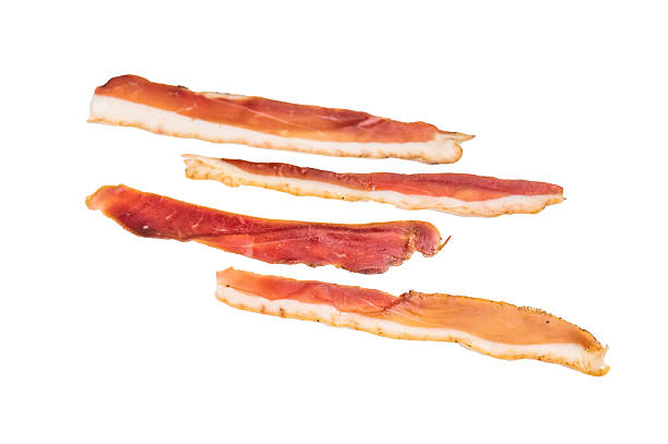 istock Smoked duck pastrami meat slices isolated on white background. top view 2219917931