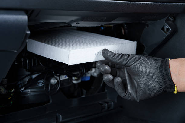 istock New cabin air filter being installed in a car. 2219919922
