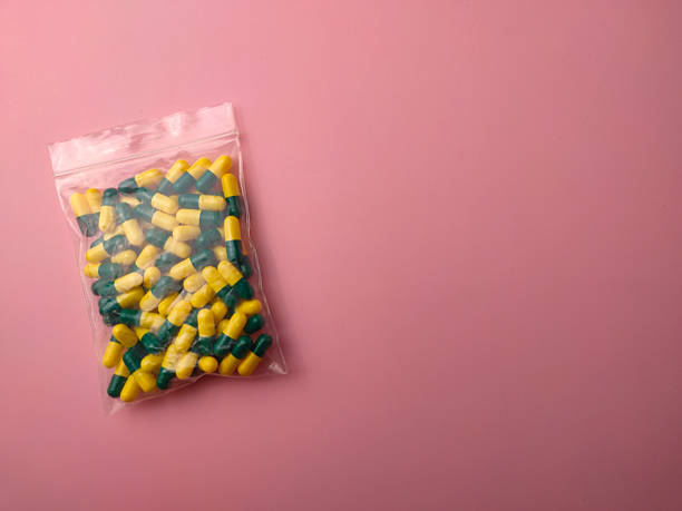 istock Top view of a medicine pill package on a pink background with copy space 2219921852