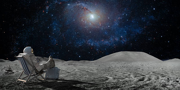 Astronaut Sitting In Deckchair On Moon Looking At Stars