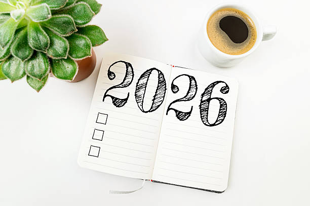 istock New year resolutions 2026 on white desk. 2026 resolutions list with notebook, coffee cup on table. Goals, resolutions, plan, action, checklist concept. New Year 2026 template 2219929084