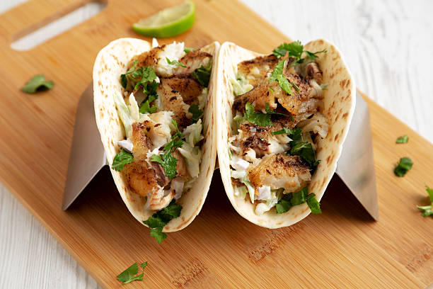 istock Homemade Fresh Fish Tacos, low angle view. 2219930428