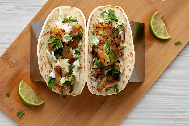 istock Homemade Fresh Fish Tacos , top view. Flat lay, overhead, from above. 2219930645