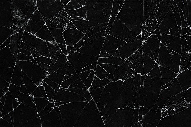 istock Pattern on cracked glass. damage to glass. broken or damaged background on glass wall 2219931801