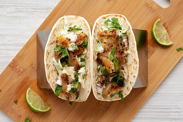istock Homemade Fresh Fish Tacos , top view. Flat lay, overhead, from above. 2219932317