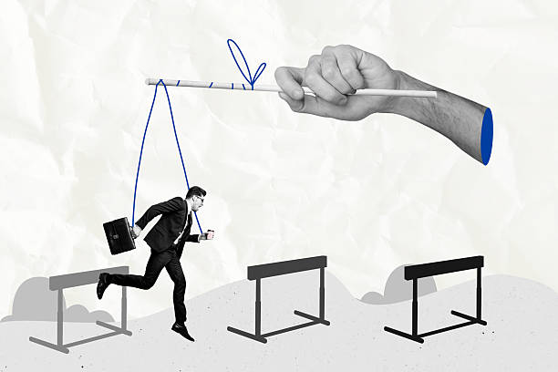 istock Creative picture collage young businessman hang strings ropes stick 3d hand hold manipulate control doll puppet overcome obstacles 2219935415