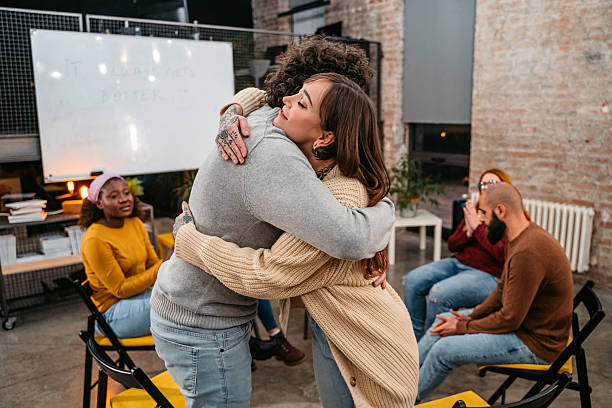 istock Support Group Therapy Patients Embracing Each Other At The Group Therapy Indoors 2219936271