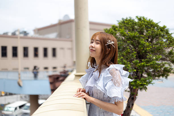 Young female tourist looking at view from pedestrian walkway