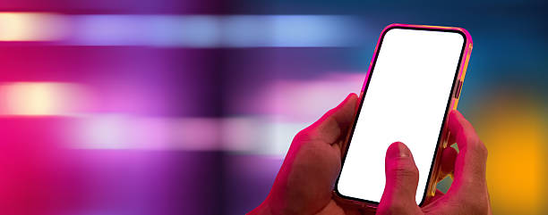 istock Mockup of Smartphone with Blank Screen in Neon Light Background 2219939254