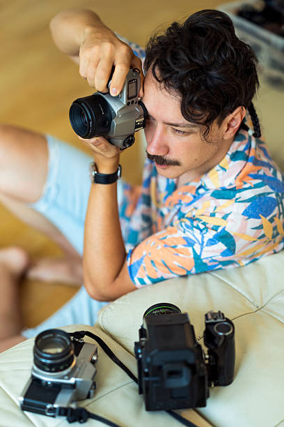 istock Man with Vintage Camera Indoors 2219940263