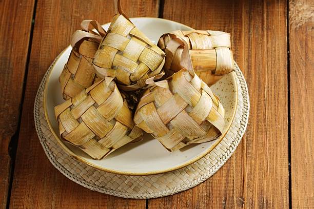 istock Indonesian Ketupat Rice Cakes in Rustic Setting 2219942737