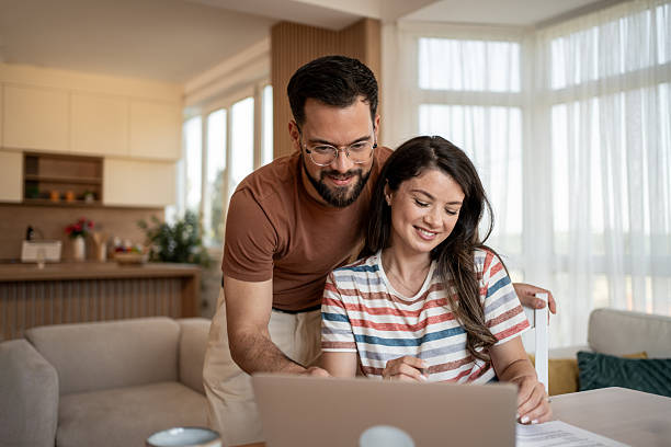 istock Young couple managing finances and budget at home 2219943639