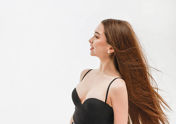 Girl with long hair on a white background.
