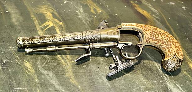 Old West vintage weapon - Volcanic Repeating Pistol on wooden table