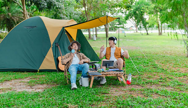 istock Friends Enjoy Music at Lakeside Camp 2219948762