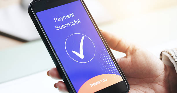 istock Hands, phone and payment on screen for business, ecommerce and check mark for approved transaction. Woman, mobile and tick on display for online shopping, company finance and purchase confirmation 2219948869