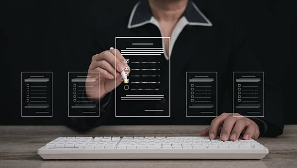 istock Performance checklist concept : businessman using finger with mobile phone for questionnaire, evaluation, assessment online or survey exam and filling out for digital survey and checklist. 2219950296