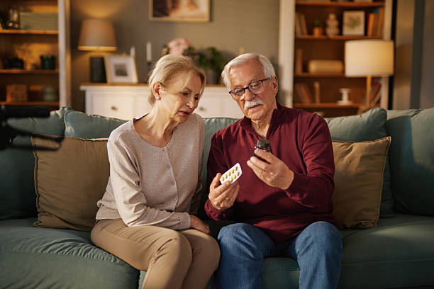 istock Senior couple reading medicine instructions at home 2219954437