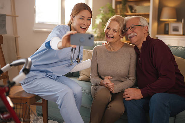 istock Nurse taking selfie with elderly couple at home 2219954631
