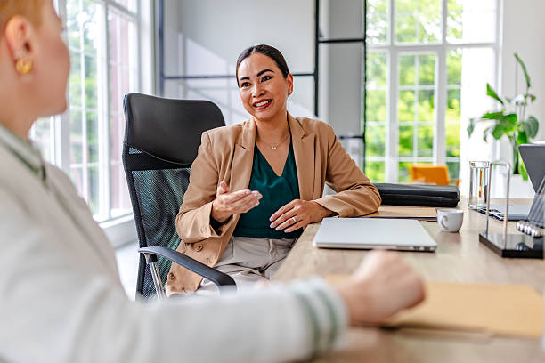 istock Modern industrial office setting with young professionals engaging in a business discussion 2219954688