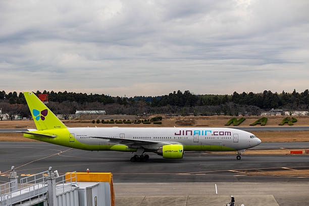 Narita, Japan - December 19, 2023 : Jin Air Boeing 777-200ER at Narita International Airport in Japan. Jin Air is a South Korean low-cost airline.