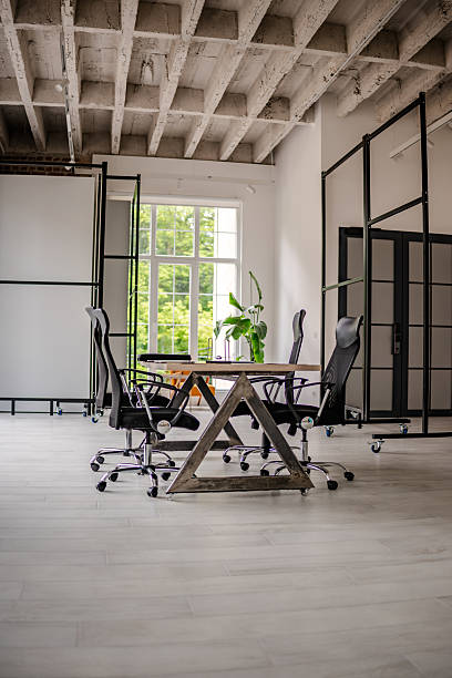 istock Modern industrial office space with collaborative meeting area and natural daylight 2219955476